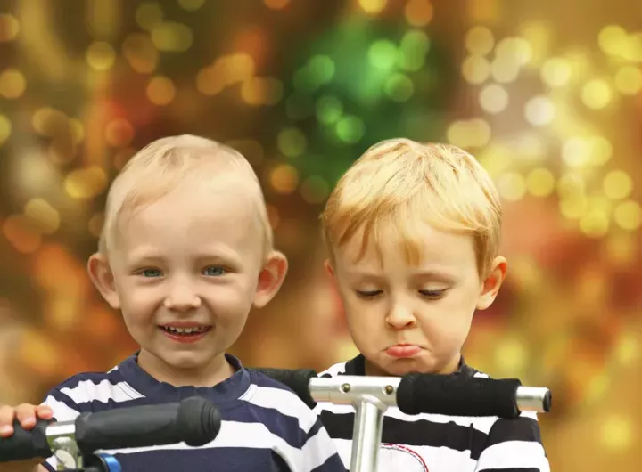 happy boy and unhappy boy at Christmas