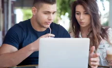 Confused parents look at computer